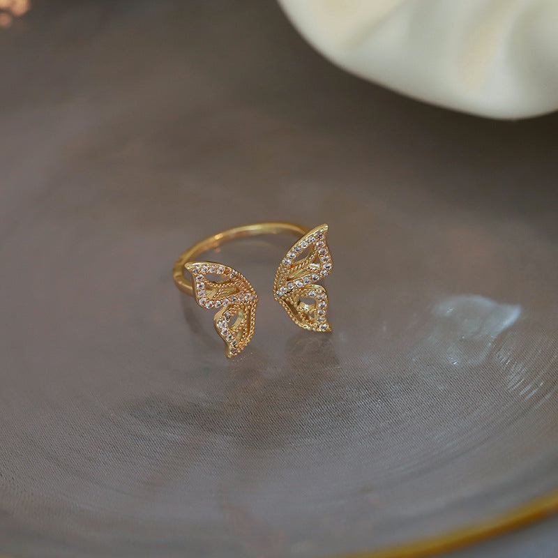 gold sparkly butterfly wings ring.