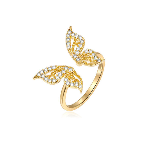 gold sparkly butterfly wings ring.